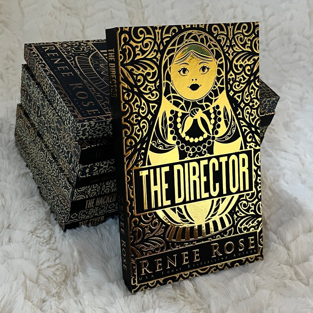 Decorative book titled 'The Director' by Renee Rose on a textured white surface