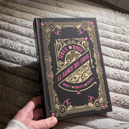 black cover with gold foil & pink text