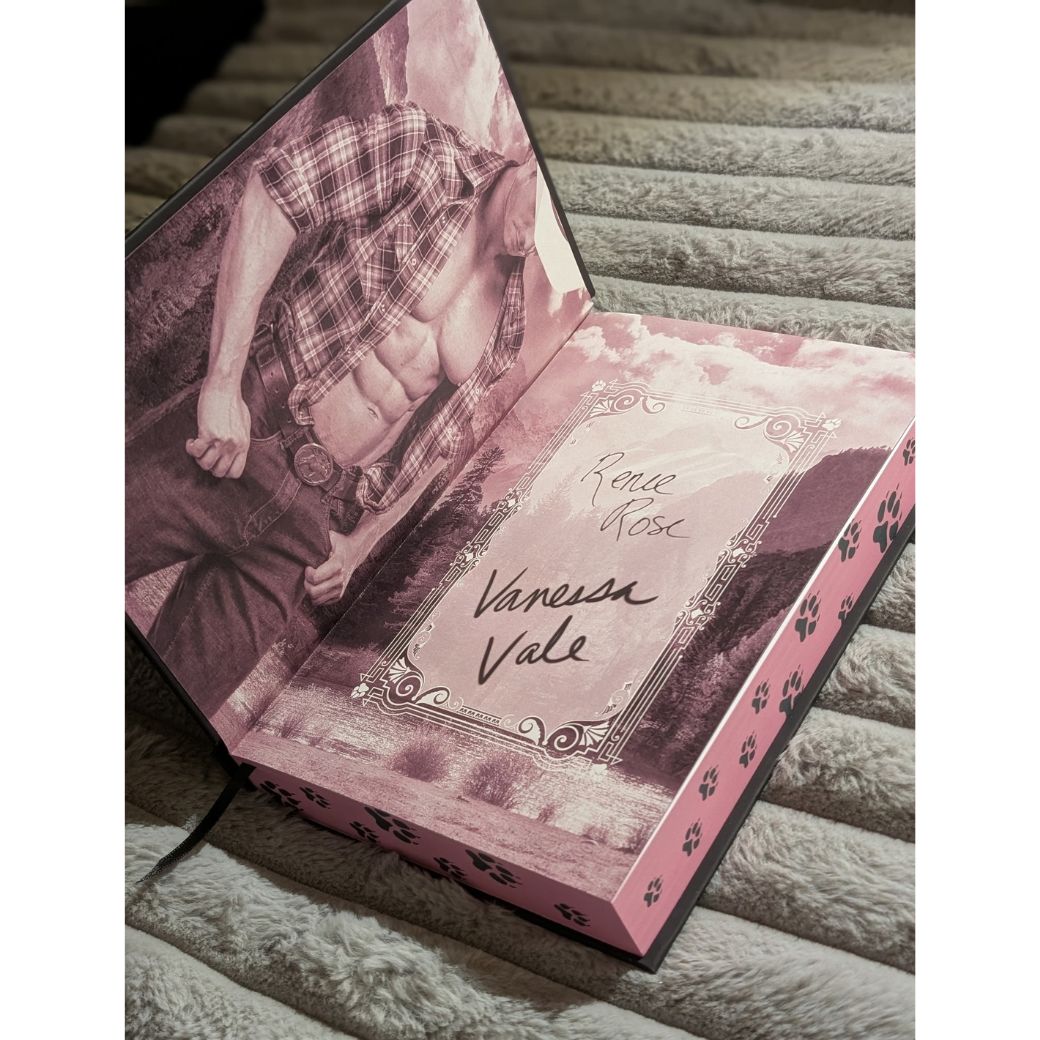 inside cover showing bare chested man and Renee Rose and Vanessa Vale's signaures