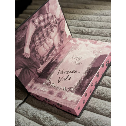inside cover showing bare chested man and Renee Rose and Vanessa Vale's signaures