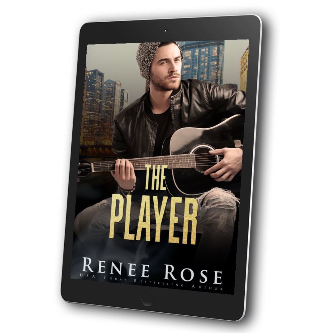 An image of an ebook. The cover features a white, slightly bearded man looking off into the distance. He is wearing ripped jeans, a black shirt, a black leather jacket, a beanie, and is playing a black guitar. In yellow text is the title "The Player." On the bottom of the cover in white text is "Renee Rose -- USA Today Bestselling Author"