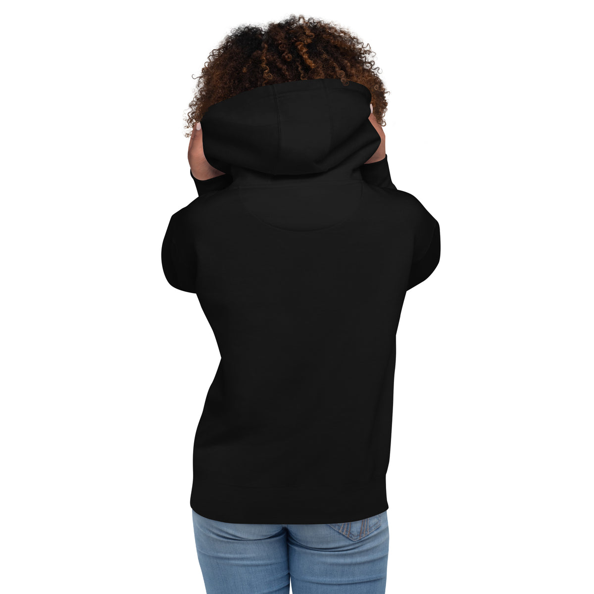 Person wearing a black sleeveless hoodie on a white background with her back to camera