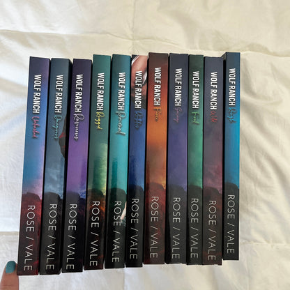 Spines of 11 Wolf Ranch paperbacks